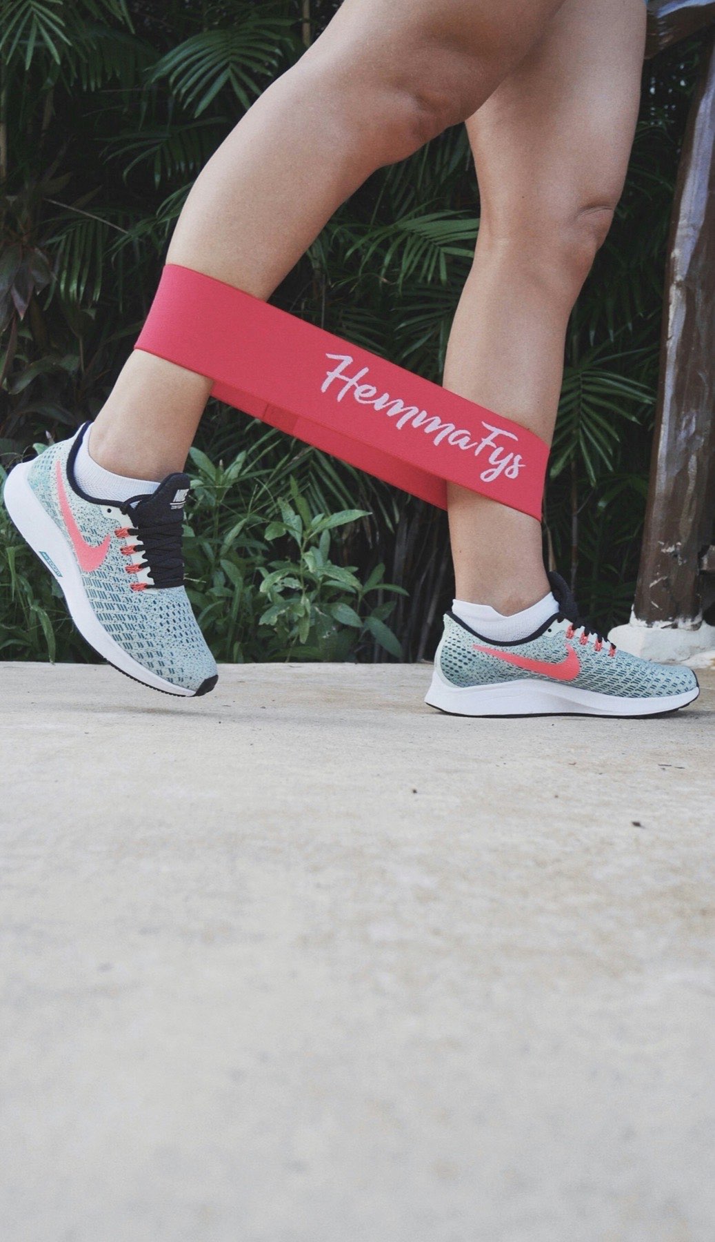 Close-up of a resistance band looped around both ankles