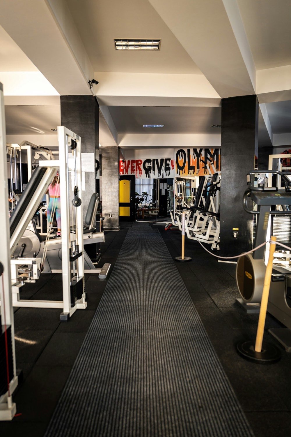A commercial gym floor with selectorized machines